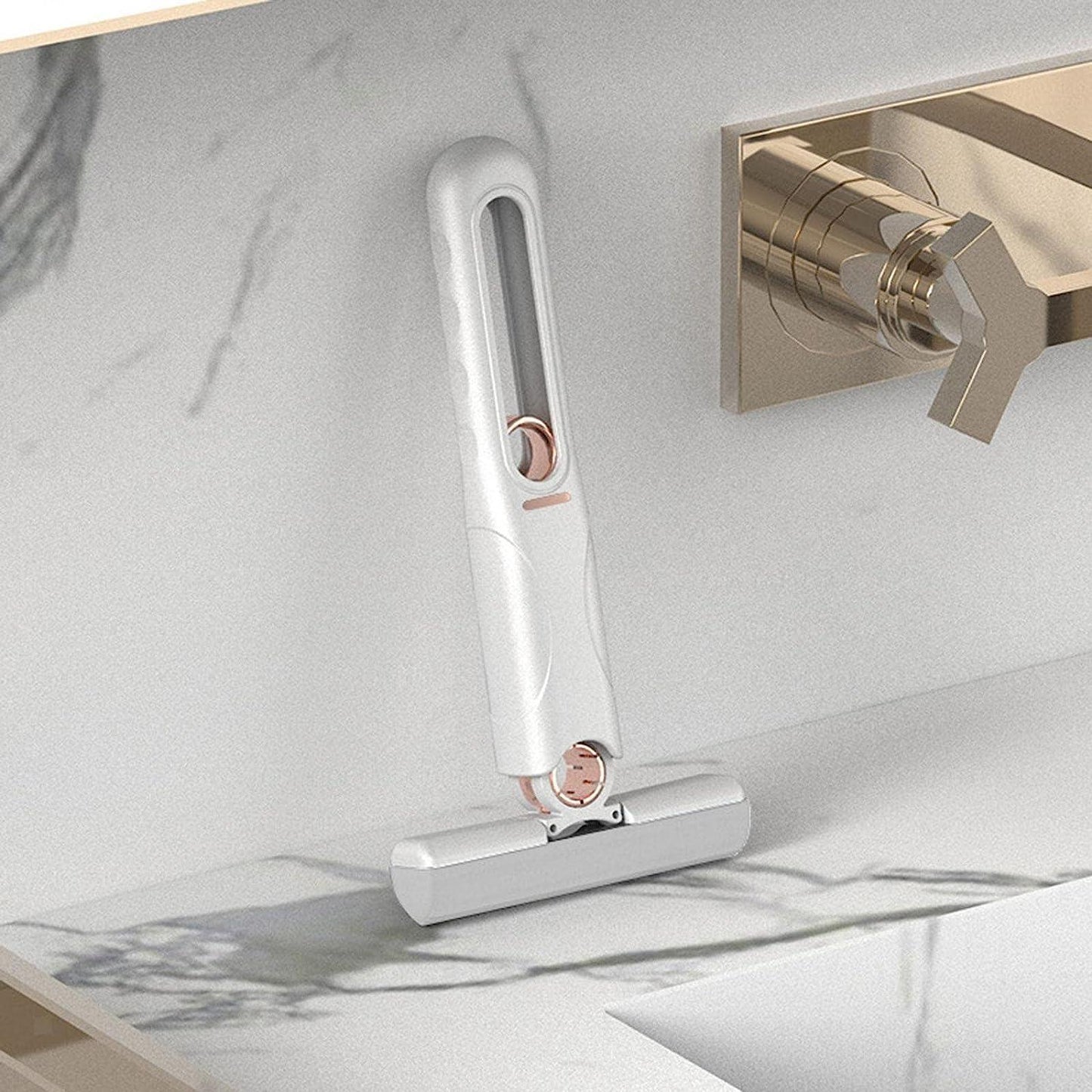 Foldable mini mop on wall-mounted hook for organized storage