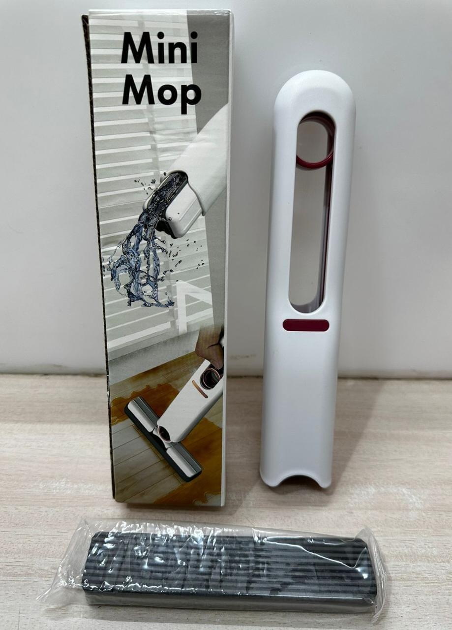 Mini mop cleaning a counter surface, demonstrating ease of use